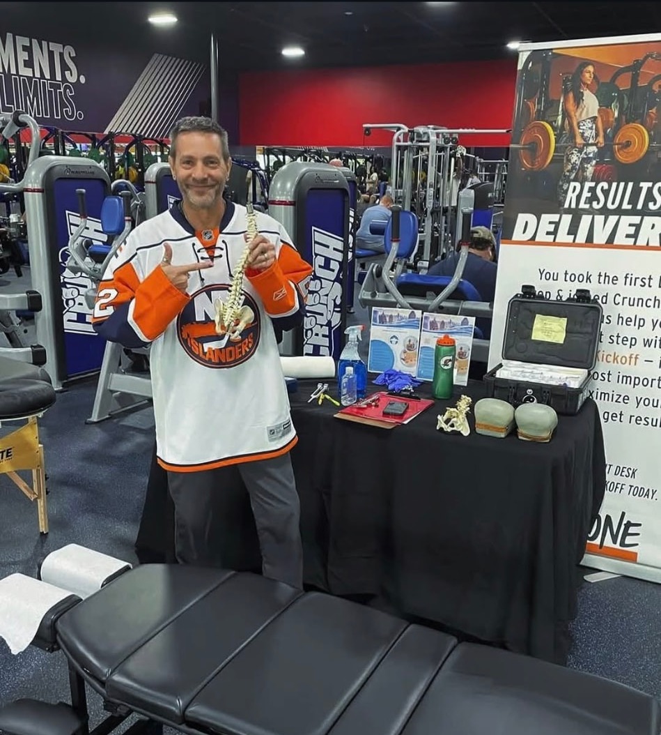 Dr. Woltin with his mobile chiropractic setup