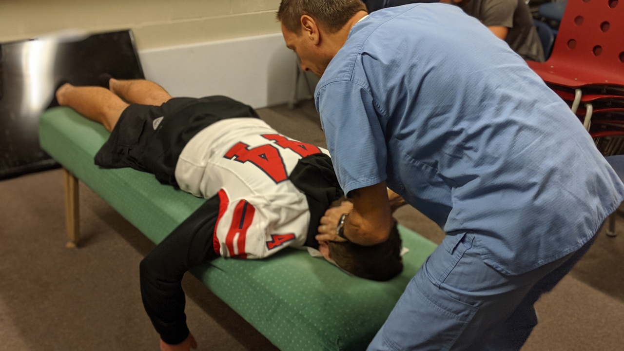 Dr. Woltin performing a hands-on adjustment